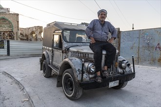Man on his old russian jeep
