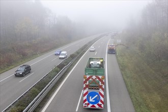 Escort vehicle for protection during mowing work on motorway in autumn