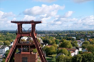 View from the roof terrace of the Zeche Zollverein Visitor Centre of the winding tower and Katernberg district