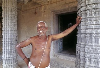Temple priest standing Kampaheswarar temple in Thirubuvanam near Kumbakonam