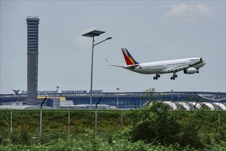 Air traffic control tower Suvarnabhumi Airport and aircraft Philippine Airlines Airbus A330-300 Bangkok