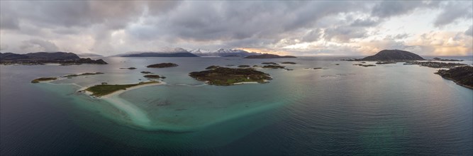 View over the sea with fish farms to Baltsfjorden and the mountains of Balten