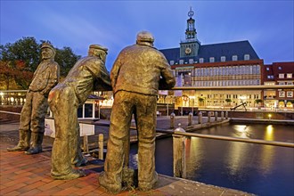 Bronze statues of dolphin spitters on the Ratsdelft in front of the Ostfriesisches Landesmuseum