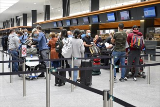 Passengers checking in at Zurich Airport