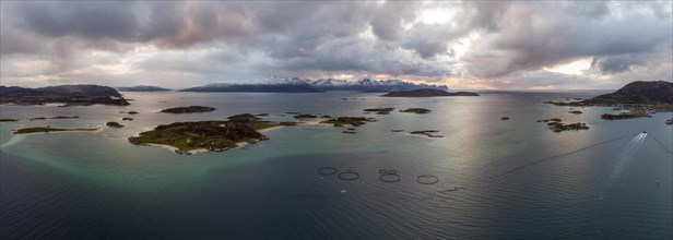 View over the sea with fish farms to Baltsfjorden and the mountains of Balten
