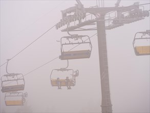 Bocksberg chairlift disappears in the fog