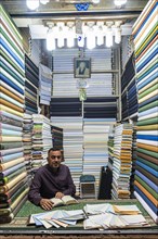 Man in his cloth shop in the Imam Ali Holy Shrine