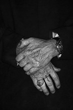 Men's hands with Russian Mafia tattoos