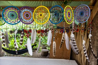 Colourful feathers or sale at the ancient Maya archaeological site Bonampak