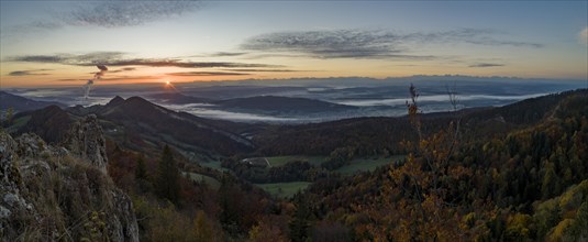 Sunrise with autumn fog with alpine panorama
