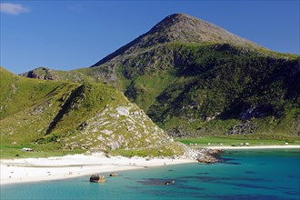 Wide beach and green mountain landscape