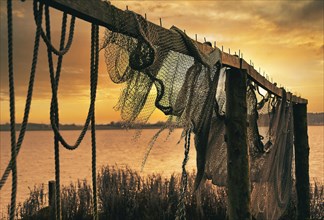 Suspended fishing nets in the sunset