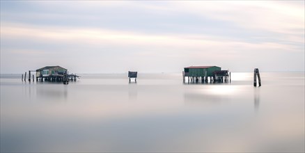Long exposure of fishermen's huts in the sea at the Lido