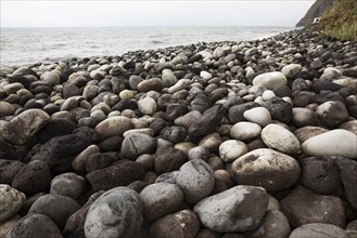 Beach with large round stones in Rocha da Relva