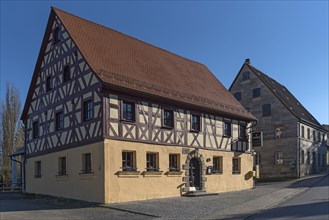 Historic half-timbered house and sandstone house from 1727