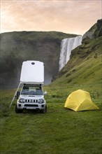 Car with roof tent and tent
