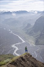 Hiker looking over landscape