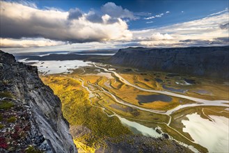 View from mountain Skierffe to the autumnal river delta Rapadalen