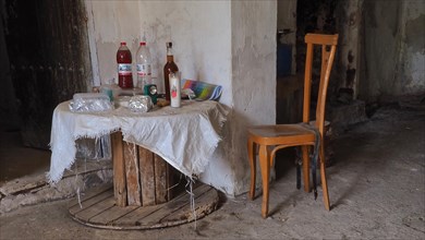 Abandoned finca as working room with chairs and wardrobe