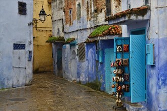 Colourful alley with souvenir stand of Chefchaouen