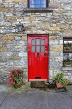 Red door in a stone house