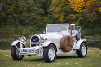 An elderly gentleman sitting in his replica of a 1923 Bugatti 35 B
