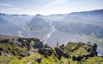 Hiker taking pictures of landscape