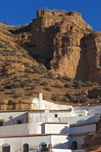 White cave houses in cave district of Guadix