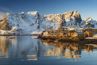 Scandinavian landscape with boathouses at the fjord