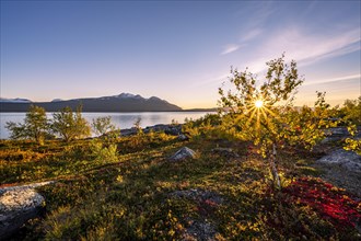 Autumnal fell landscape with lake Akkajaure and mountain range Akka