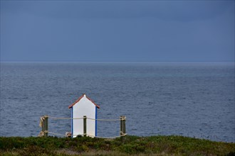 White shrine to seafarers by the sea