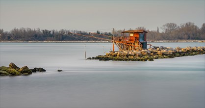 Long exposure of fishermen's huts in the sea at the Lido