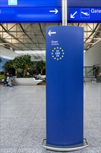 Blue exhibitor with entry notice for EU citizens at Frankfurt Airport