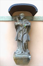 Sculpture of St. Nepomuk on a house wall