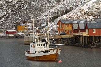 Fishing harbour in Scandinavian landscape with boathouses