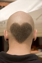Head from behind with hairdo in heart shape