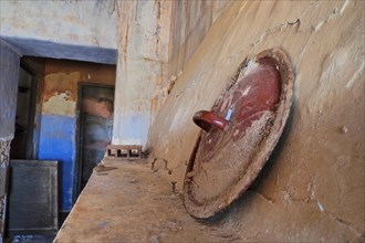 Lid of cooking pot on mantelpiece