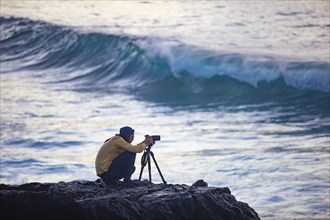 Photographer at work on the beach of Praia de Santa Barbara