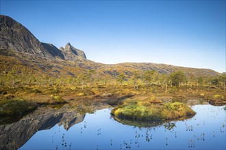 Mount Kulhornet reflected in small pond