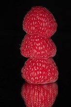 Close-up of three raspberries