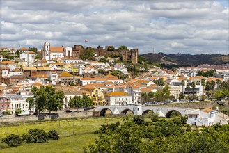 Silves cityscape with Moorish castle and cathedral on the top of the hill