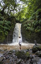 Hiker standing by the Salto do Prego waterfall