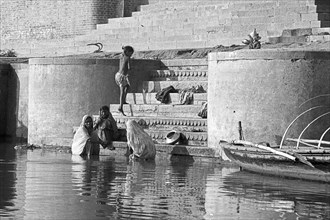 Stairs with pilgrim woman at the Assi-Ghats of Varanasi
