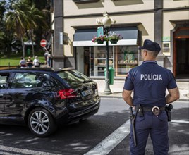 Police officer in Funchal monitors traffic