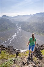 Hiker looking over landscape