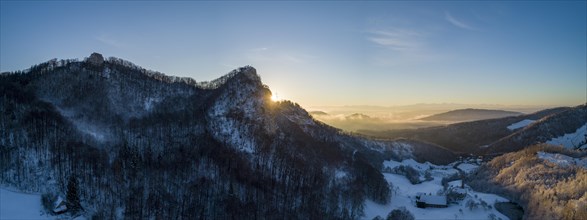 Sunrise at the Frohburg castle ruins and Geissflue summit cross