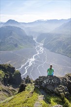 Hiker sitting on rocks