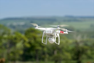 Camera drone in action in countryside