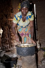Woman preparing a meal of potatoes