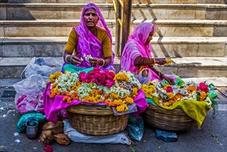 Women selling flower wreaths in front of the Jagdish temple